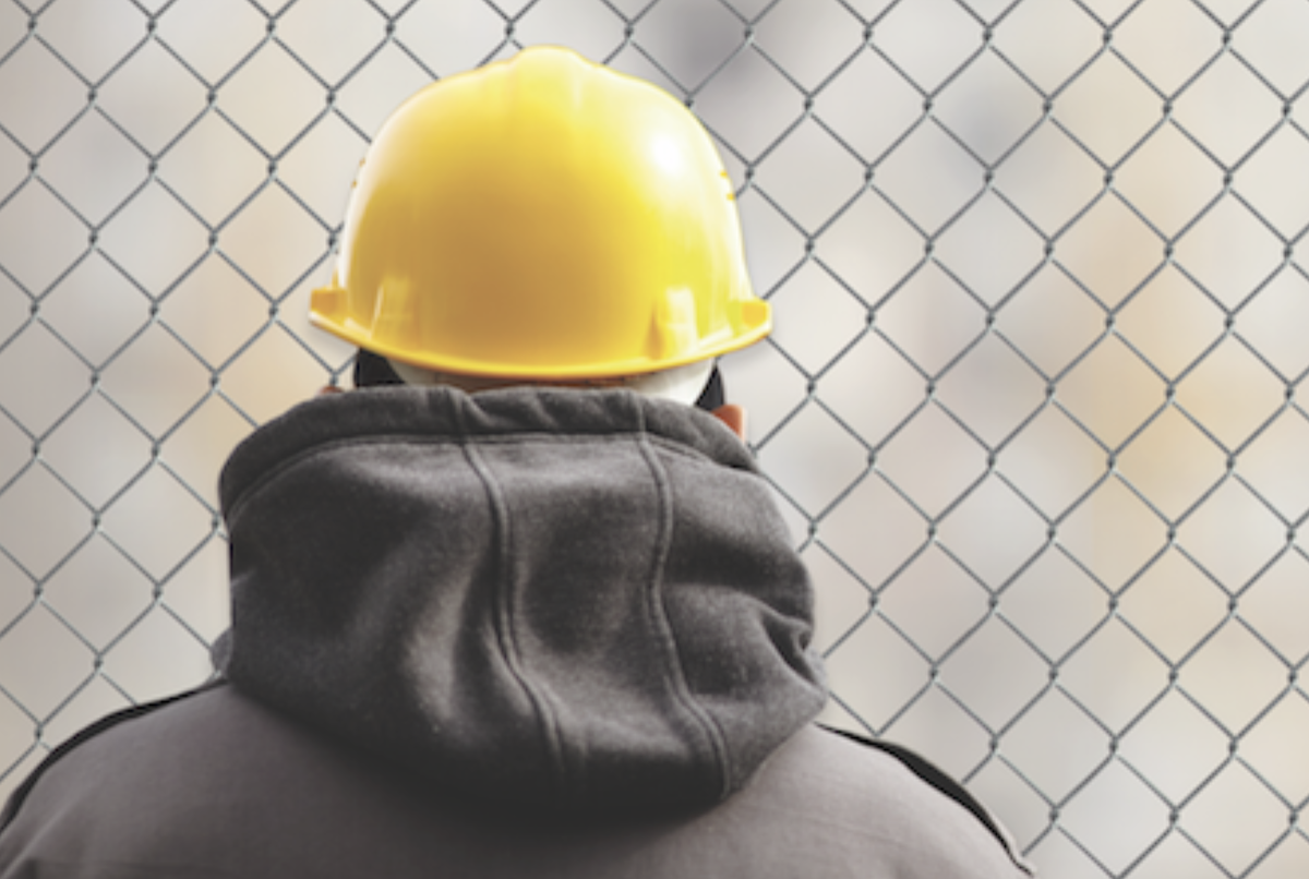 Construction worker wearing yellow hardhat
