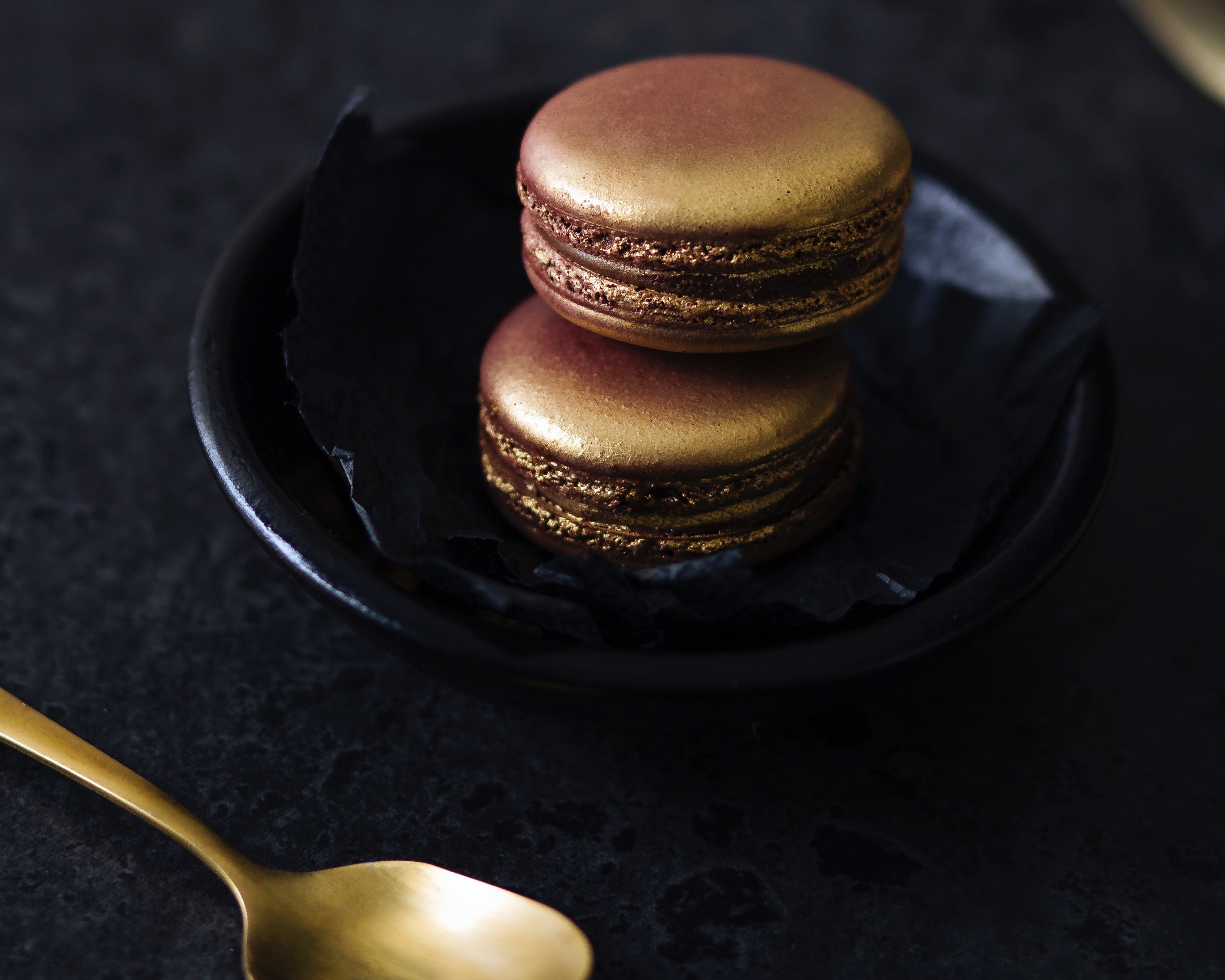 Gilt macaroons and spoon
