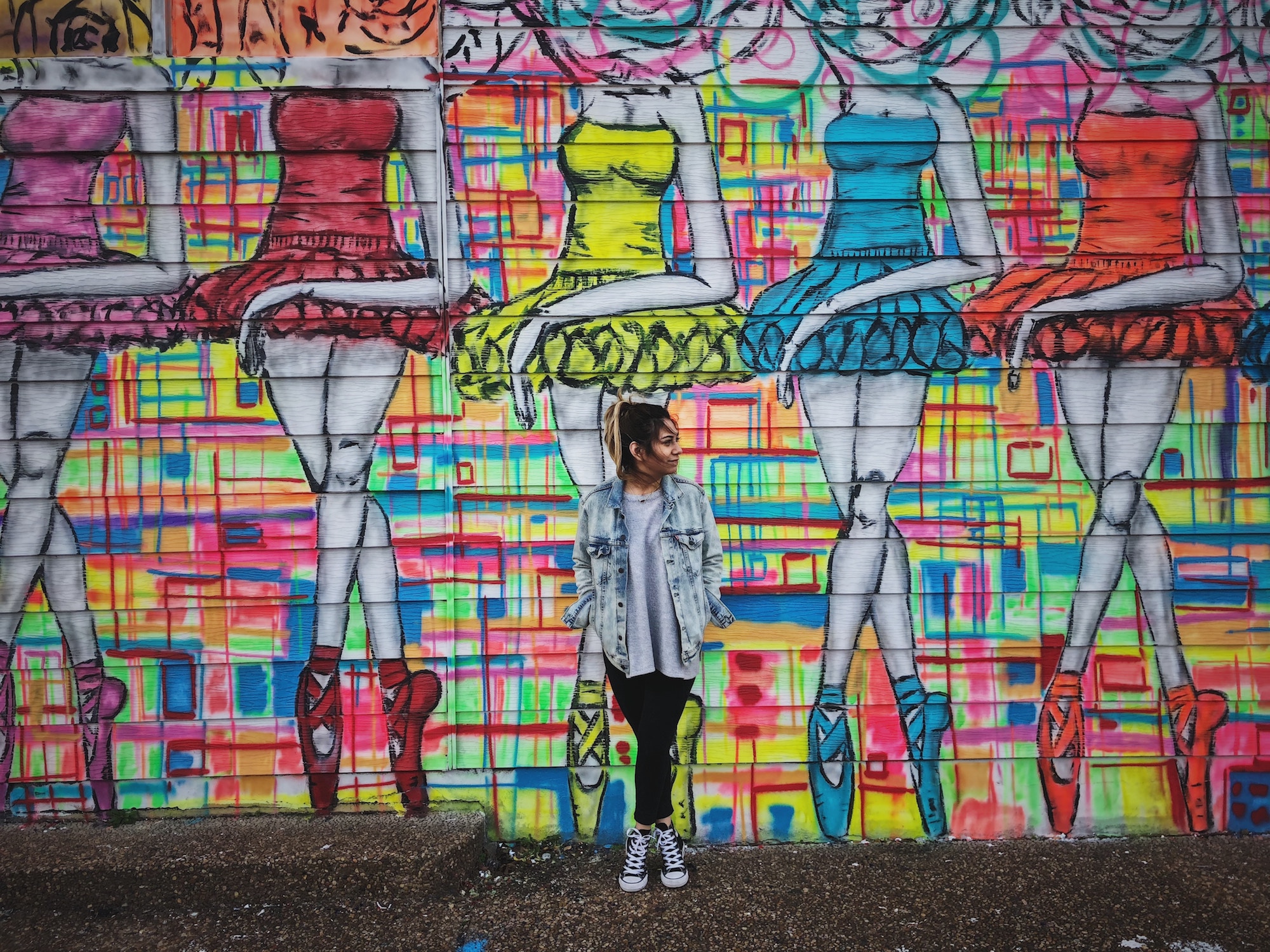 Woman standing in front of wall, Houston, Texas