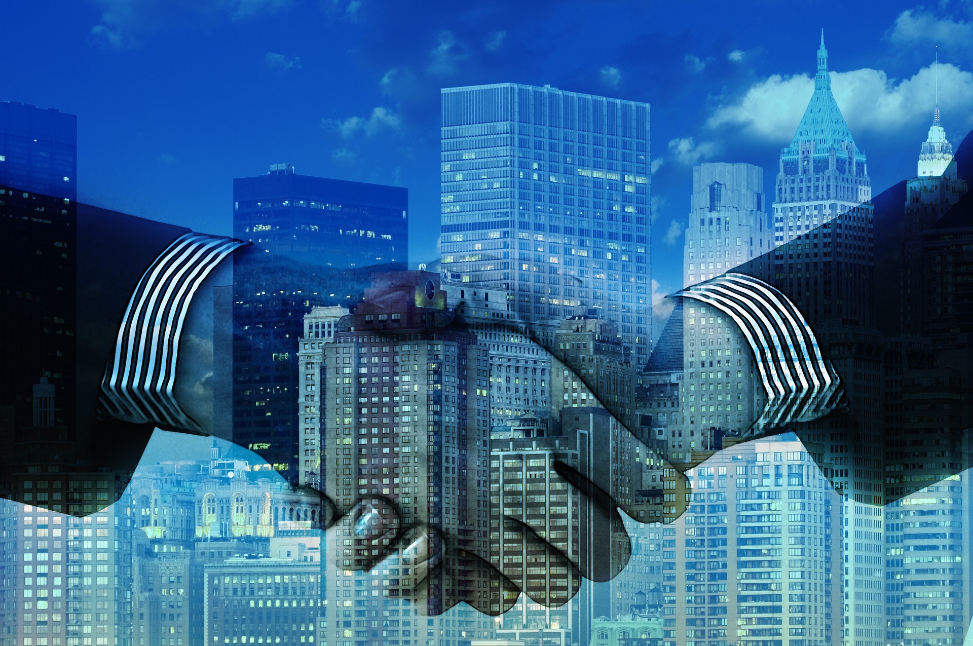 a company merger handshake for a business deal