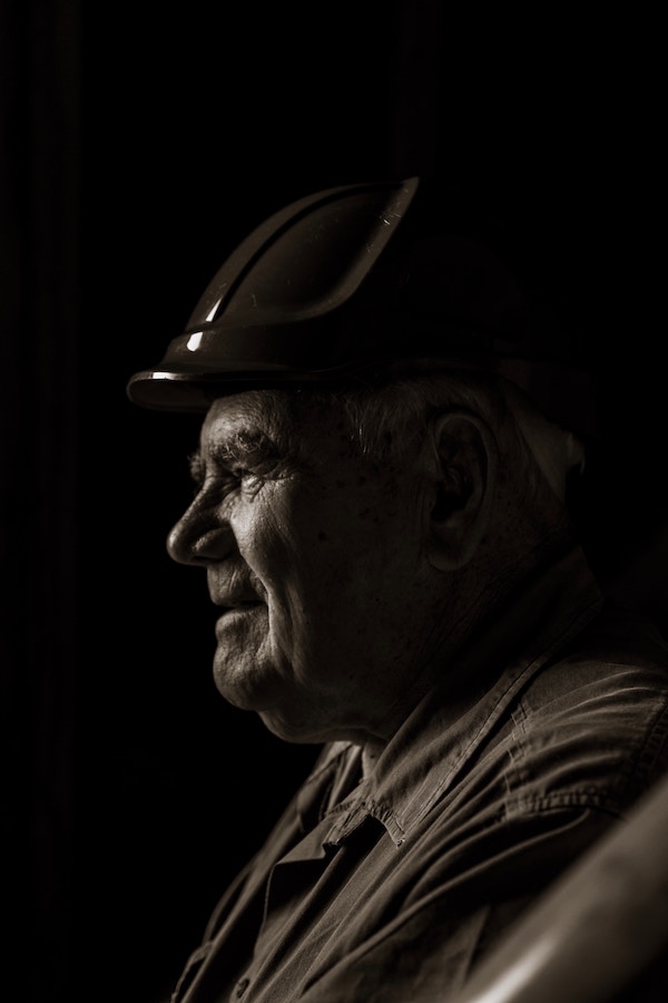 aging construction worker wearing hardhat