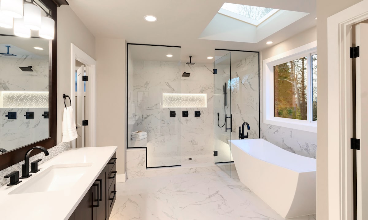 White modern spa-like bathroom with large shower and bathtub