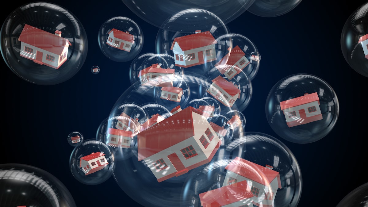 White houses with red roofing inside bubbles with black background