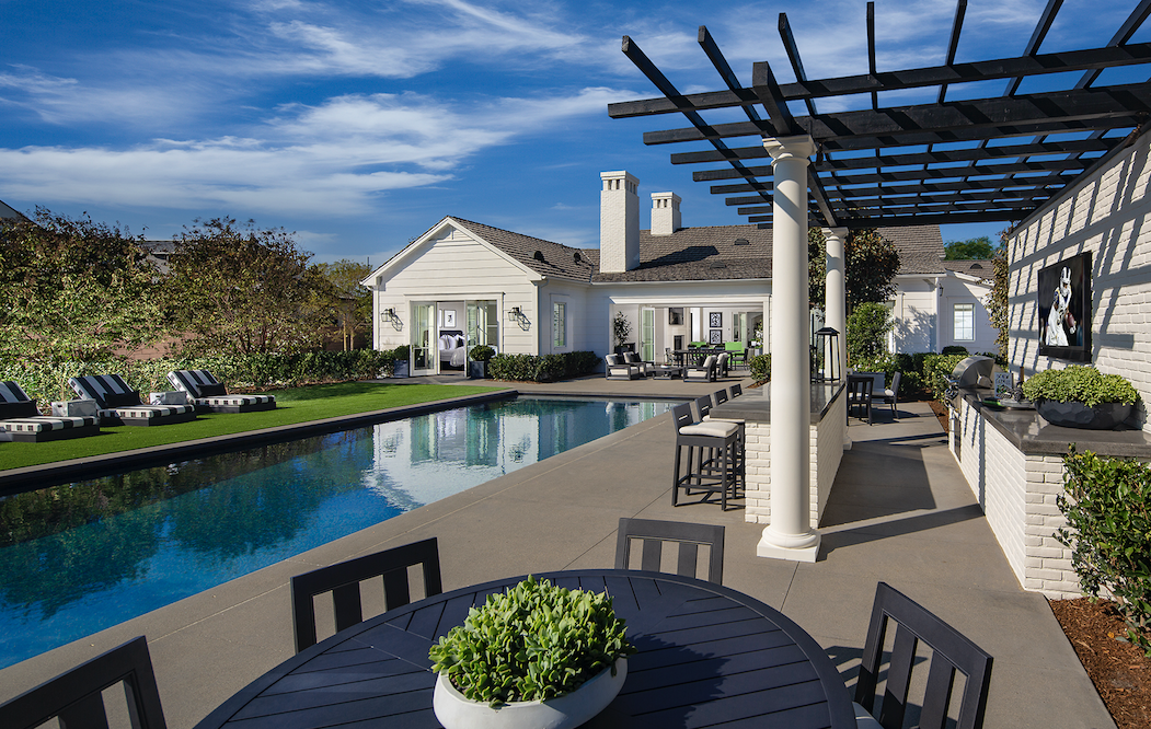 New Home Company Sky Ranch outdoor living with pool and pergola