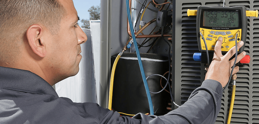 Technician testing for HVAC faults so HVAC system performance isn't compromised