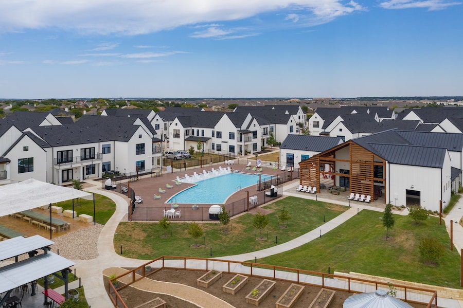 Hermosa Village multifamily rental development aerial view of amenities, pool, and clubhouse