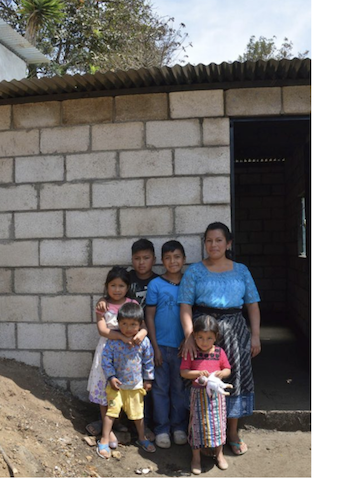 The Hernandez family in Guatamala and their new home built by The 141 Project