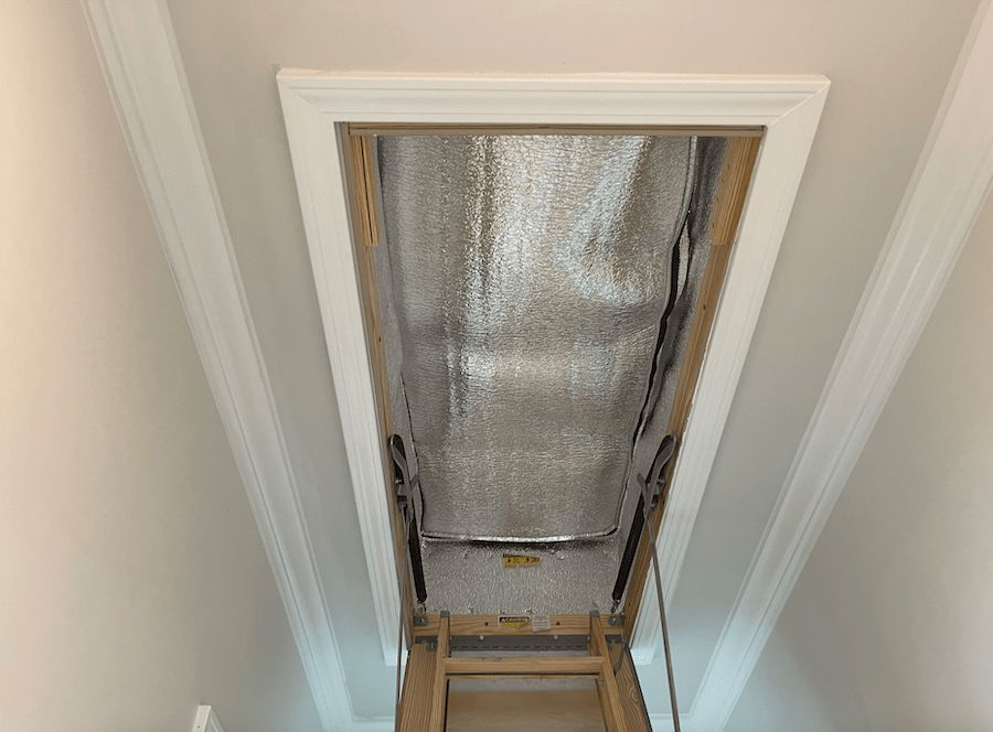 Insulated attic stair cover installed for better home insulation