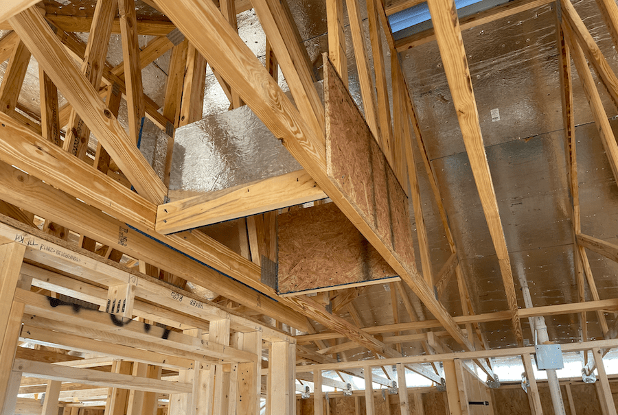 Home insulation best practice using insulation dams around ceiling penetrations