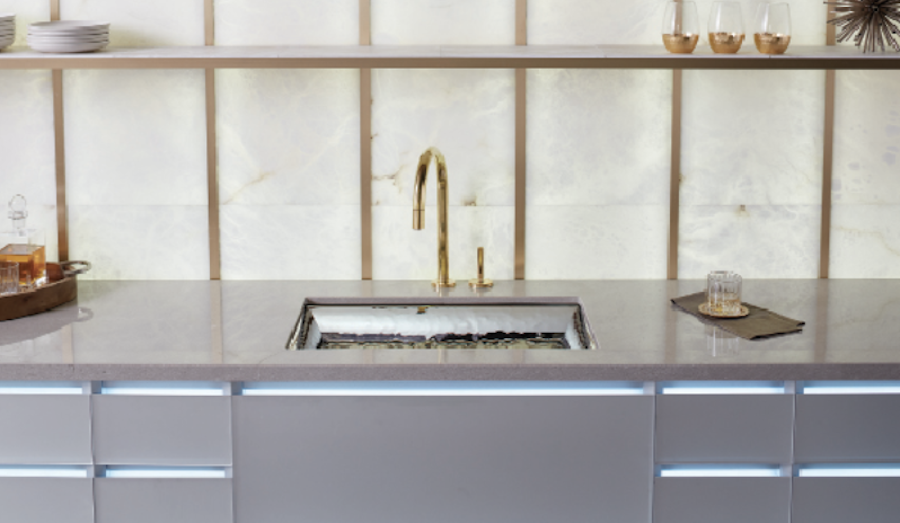 Neutral colors in the kitchen with Kohler faucet and metallic accents