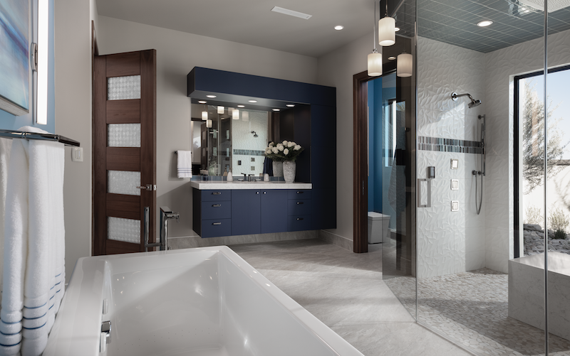 The New American Home master bath with floating vanity and blue color scheme