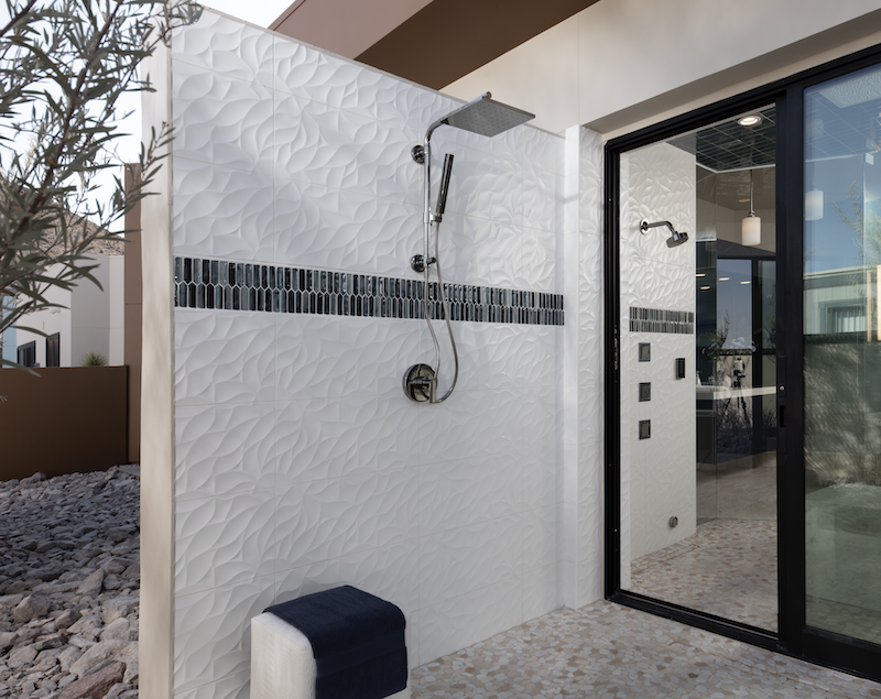 The New American Home outdoor shower with glass sliding door