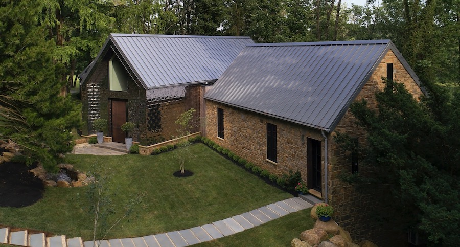 Petersen's Pac-Clad Precision Series stamped metal roofing (Diamond) installed on the walls of a home