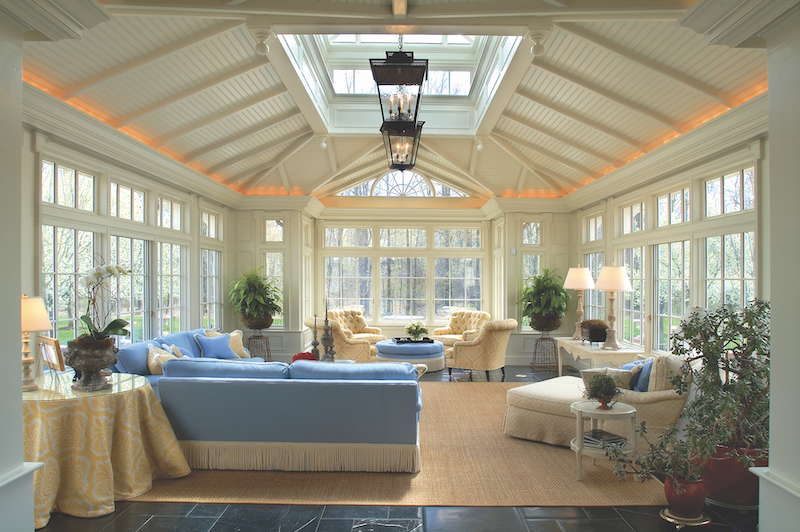 Renaissance Conservatories & Custom Skylights custom skylight over roof ridge in traditional-style interior