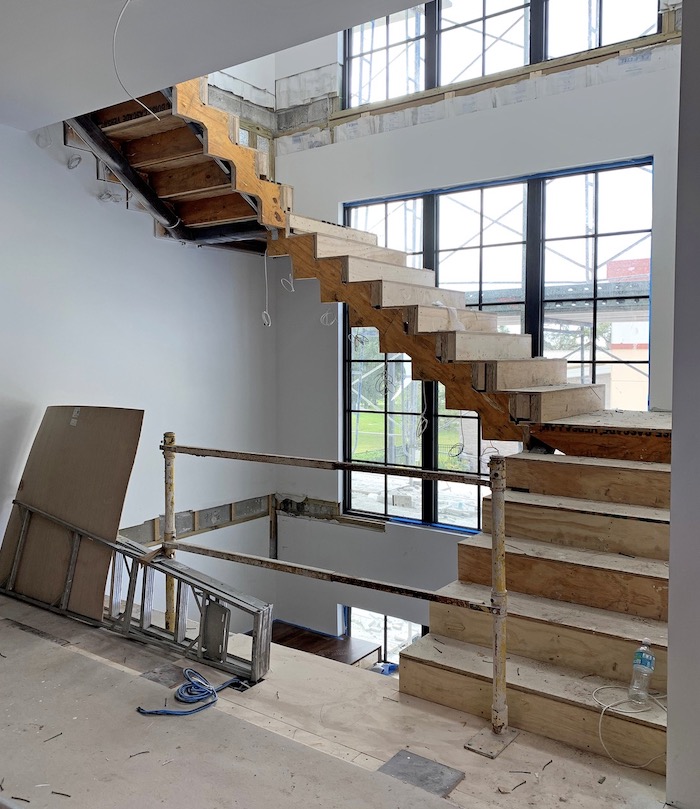 The New American Home 2021 floating stair under construction