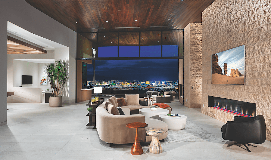 The living room in The New American Home 2024 with its views of the Vegas Strip in the distance.