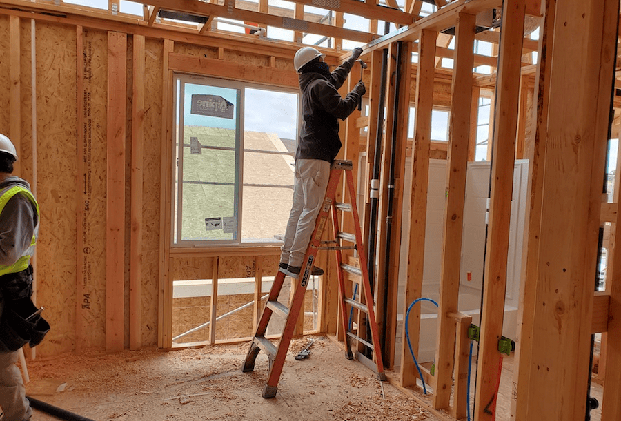Ladder safety on an A-frame ladder: the ladder is stable and is sized correctly for the task.