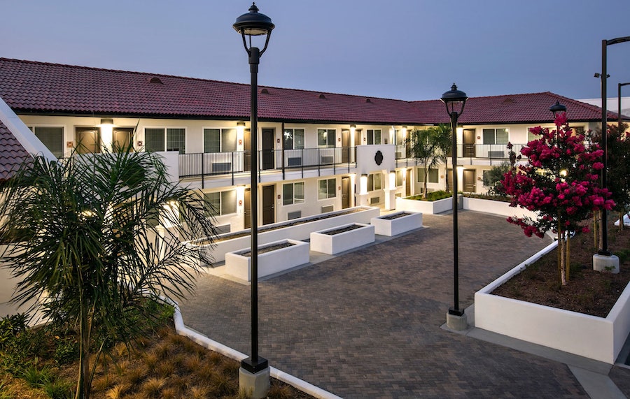 The courtyard in Buena Esperanza, a motel conversion to housing