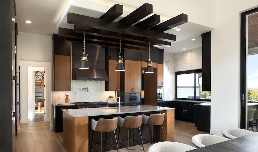 Wood tones with black provide texture and drama in this kitchen