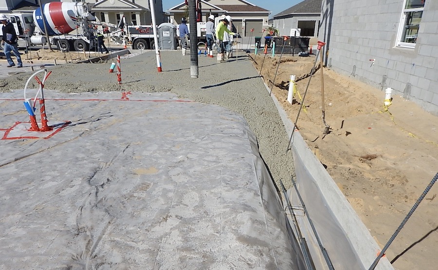 Simultaneously pouring the concrete slab and footing is a best practice that avoids cold joints