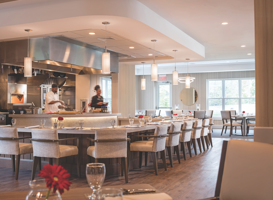 In many senior living facilities, the restaurant area is an important gathering place. At One Wingate Way, in Needham, Mass., an independent living facility by The Architectural Team, the bistro and outdoor patio are linked to the adjacent assisted living project.