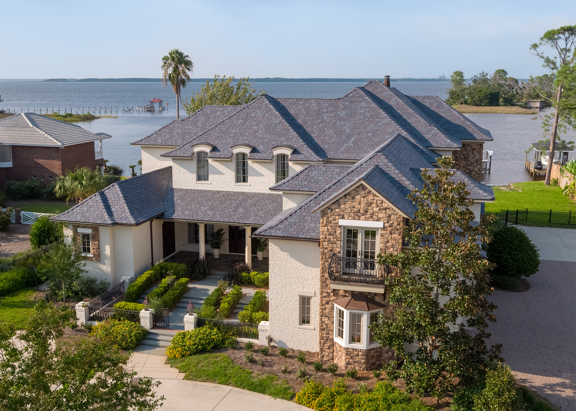 Westlake DaVinci Roofscapes’ Multi-Width Slate composite roofing on European-styled home
