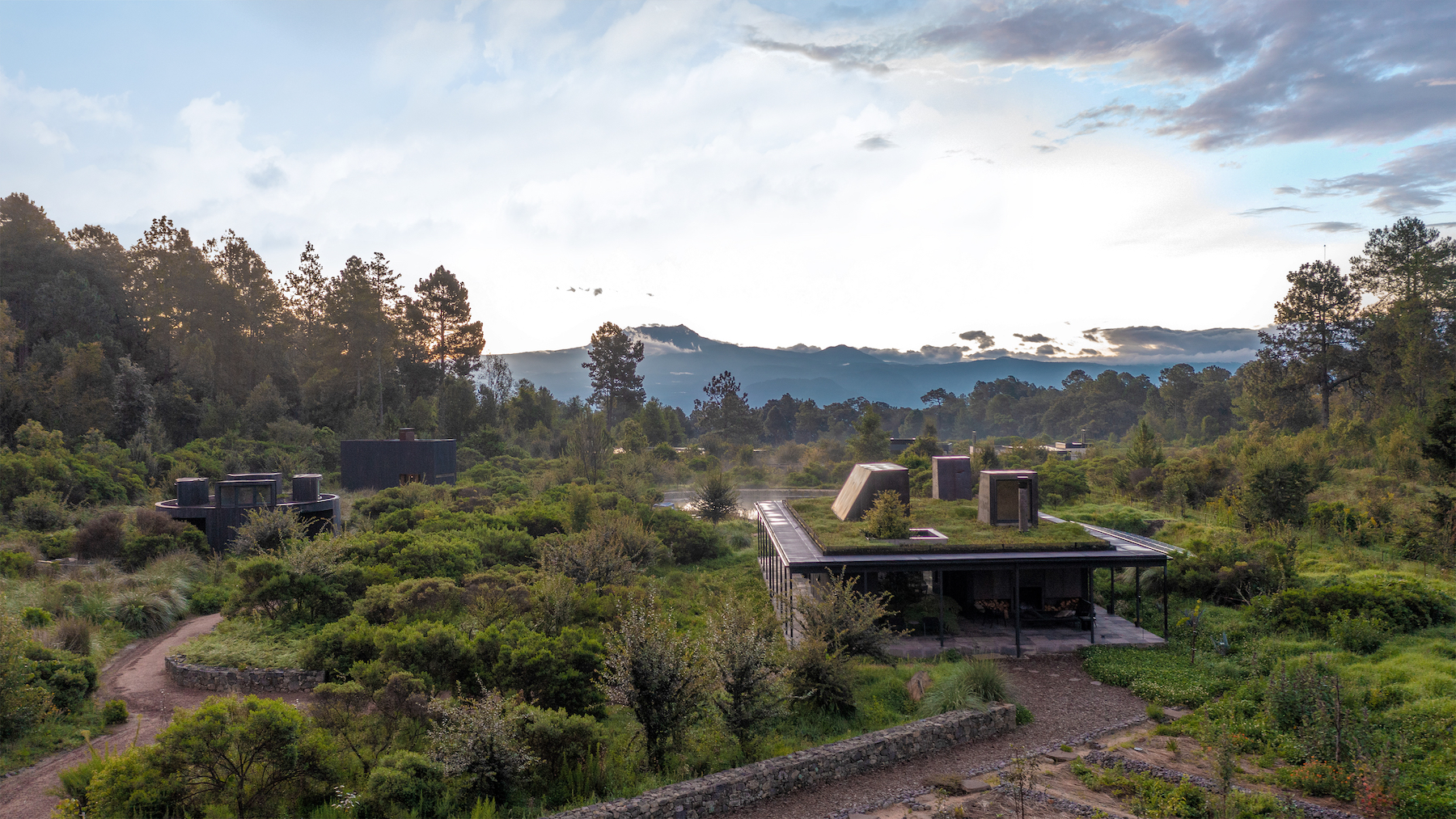  Rain Harvest Home is a water-autonomous home in Temascaltepec, Mexico that disperses living functions into three porous, green-roofed buildings that each collect rainwater.