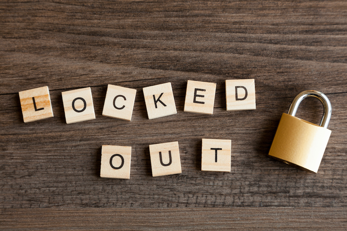 padlock and Scrabbles tiles spelling Locked Out