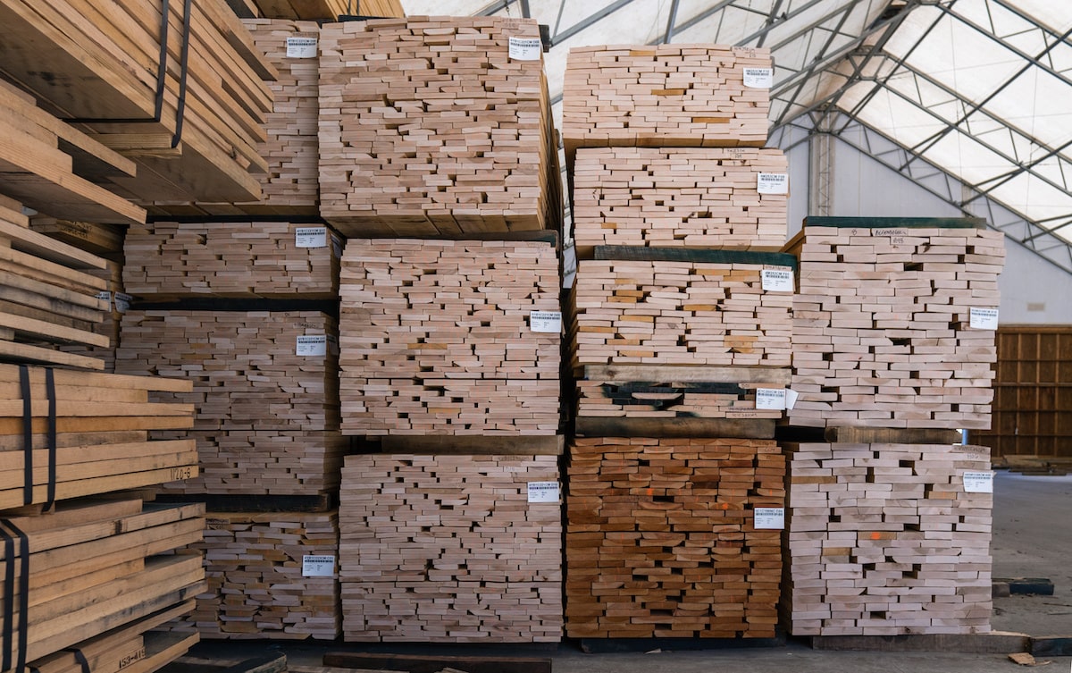 Lumber pallets marked and stacked in warehouse