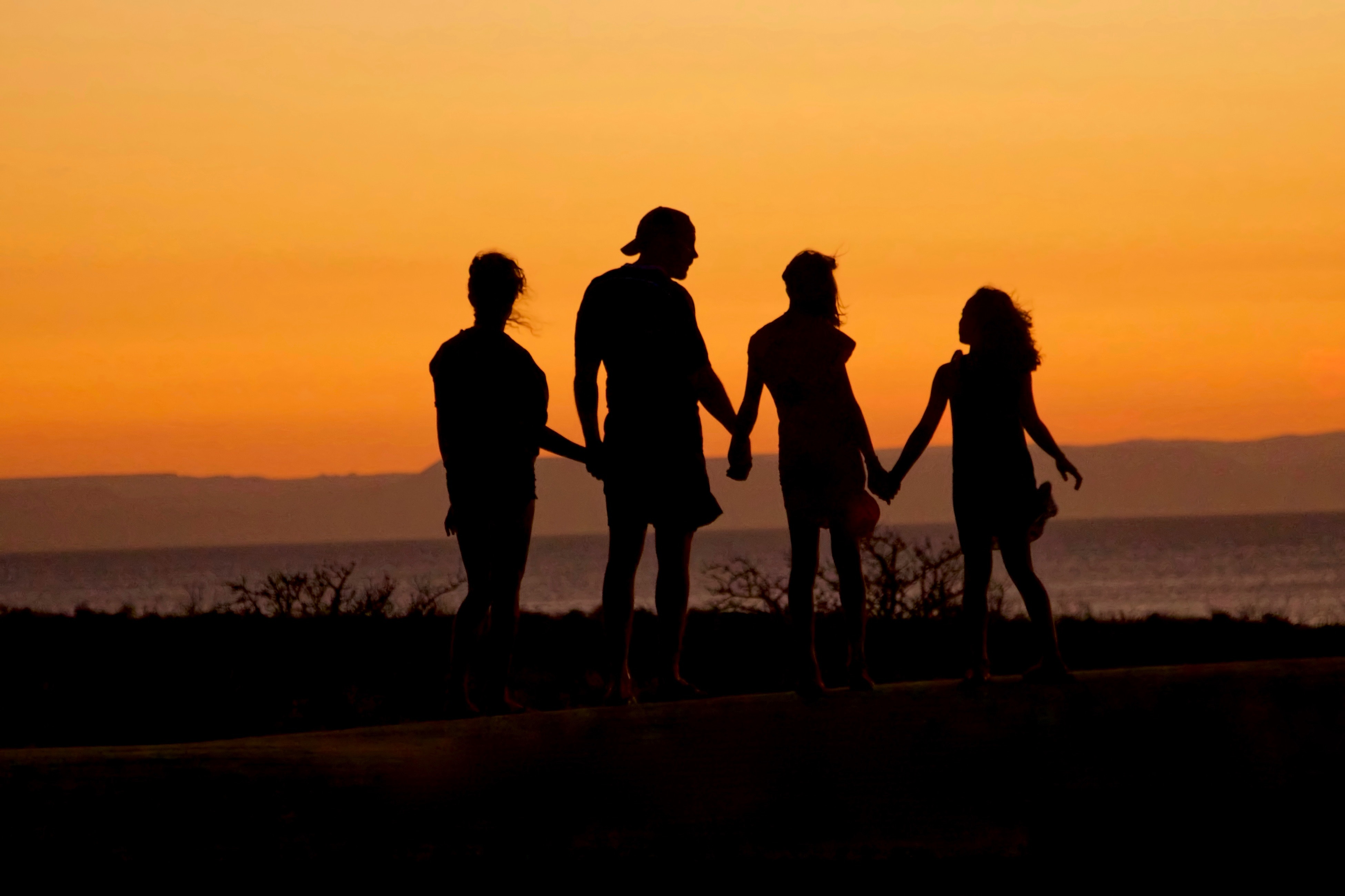 Family walking in the sunset