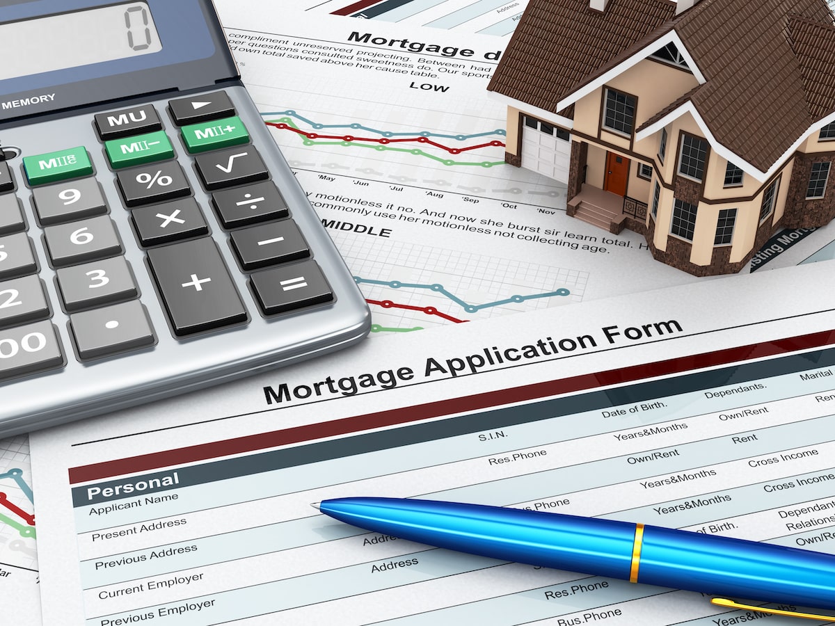 Mortgage application form with house keys