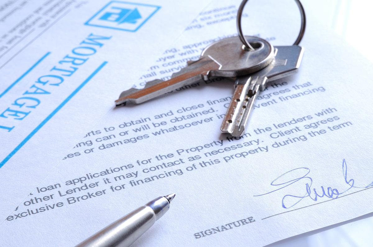 Keys on mortgage paperwork for housing contract