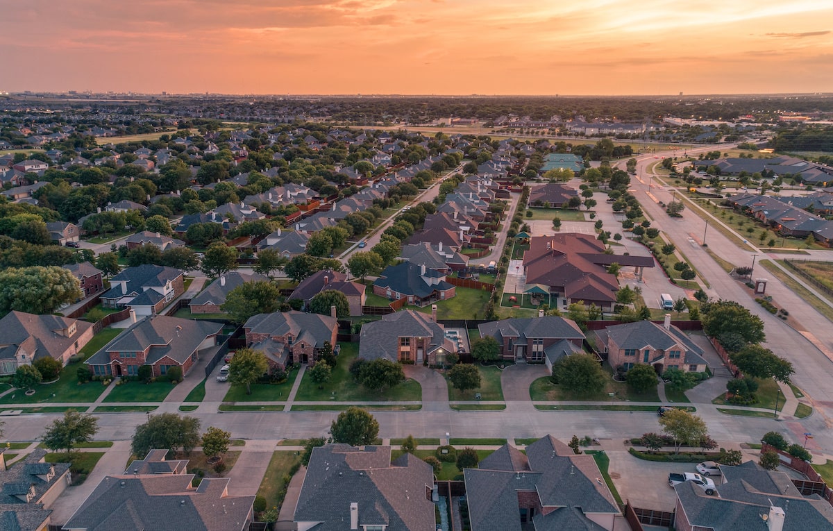 Aerial view of residential neighborhood at sunset
