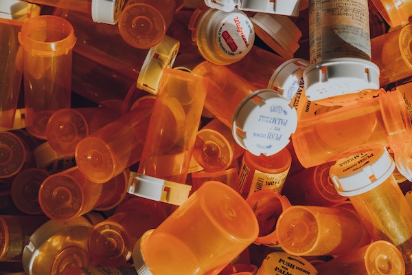 Piles of empty medication bottles