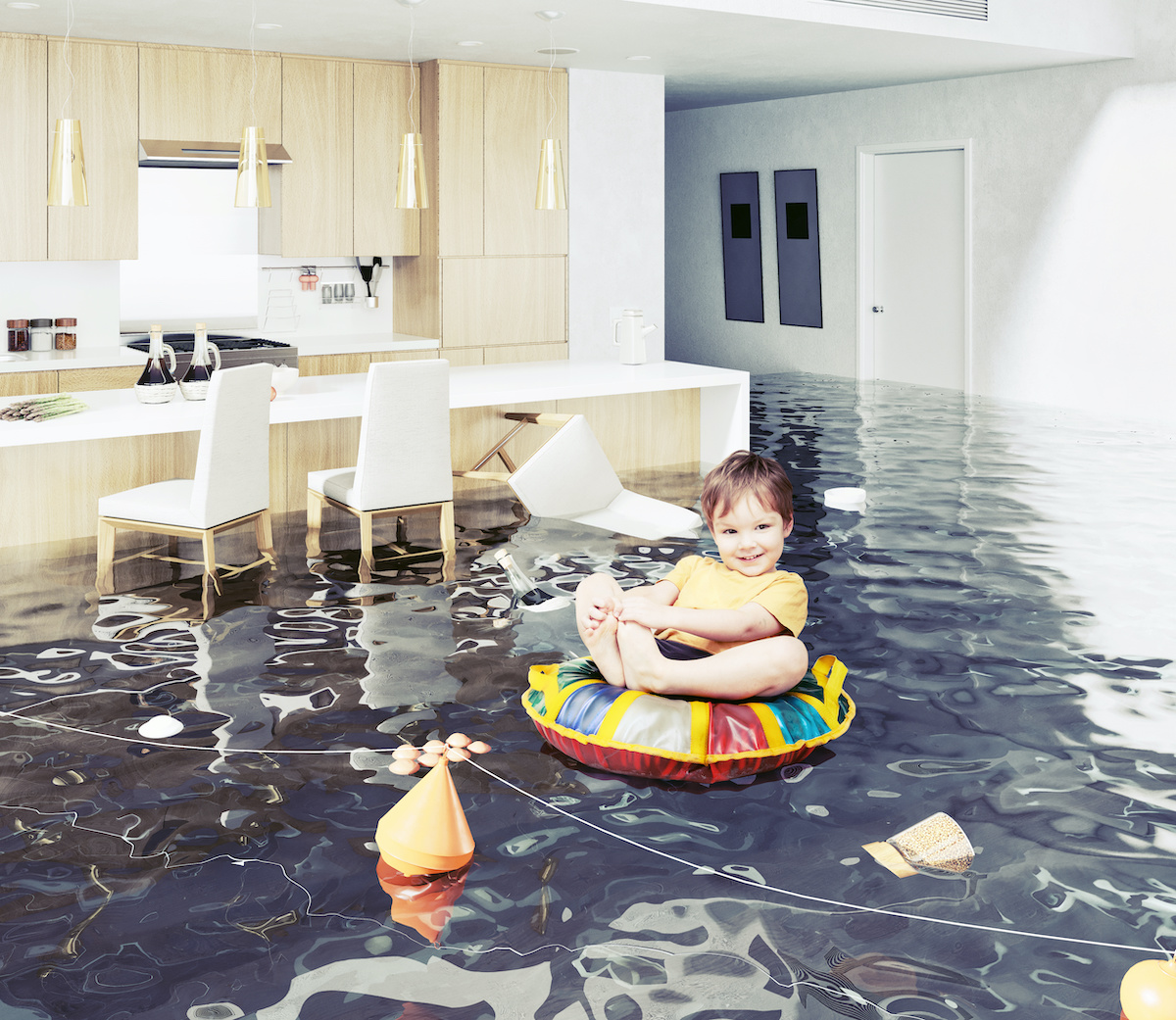 Baby on floaty in a flooded living room