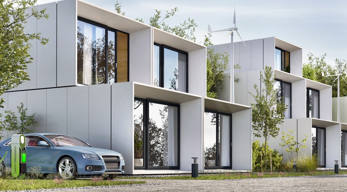 Rendering of white prefab model homes with electric cars