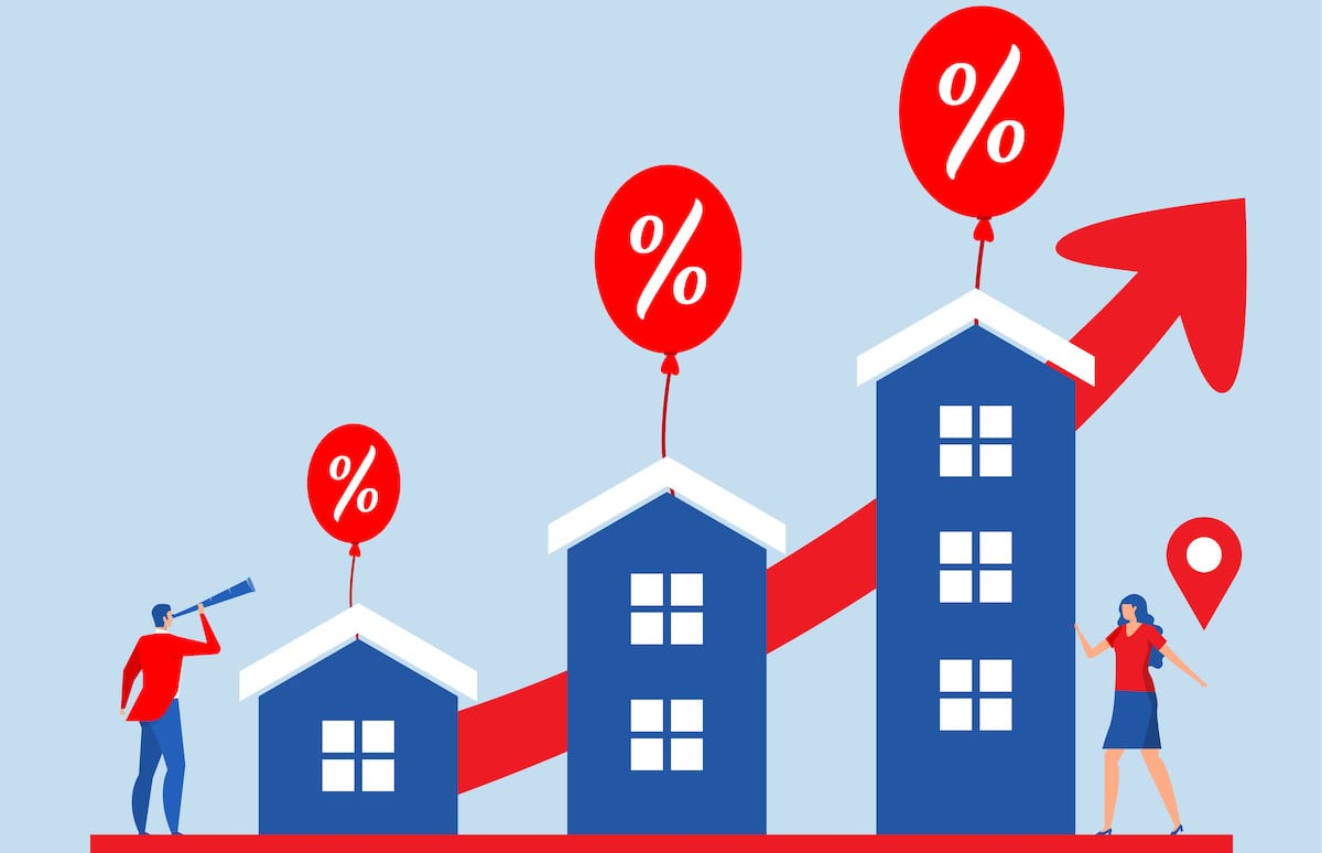 Red line graph showing prices rise behind blue houses