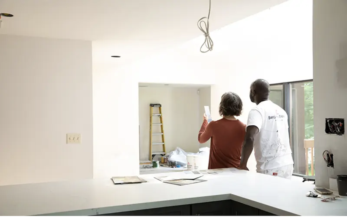 Professional painter helping a homeowner select paint colors for the home