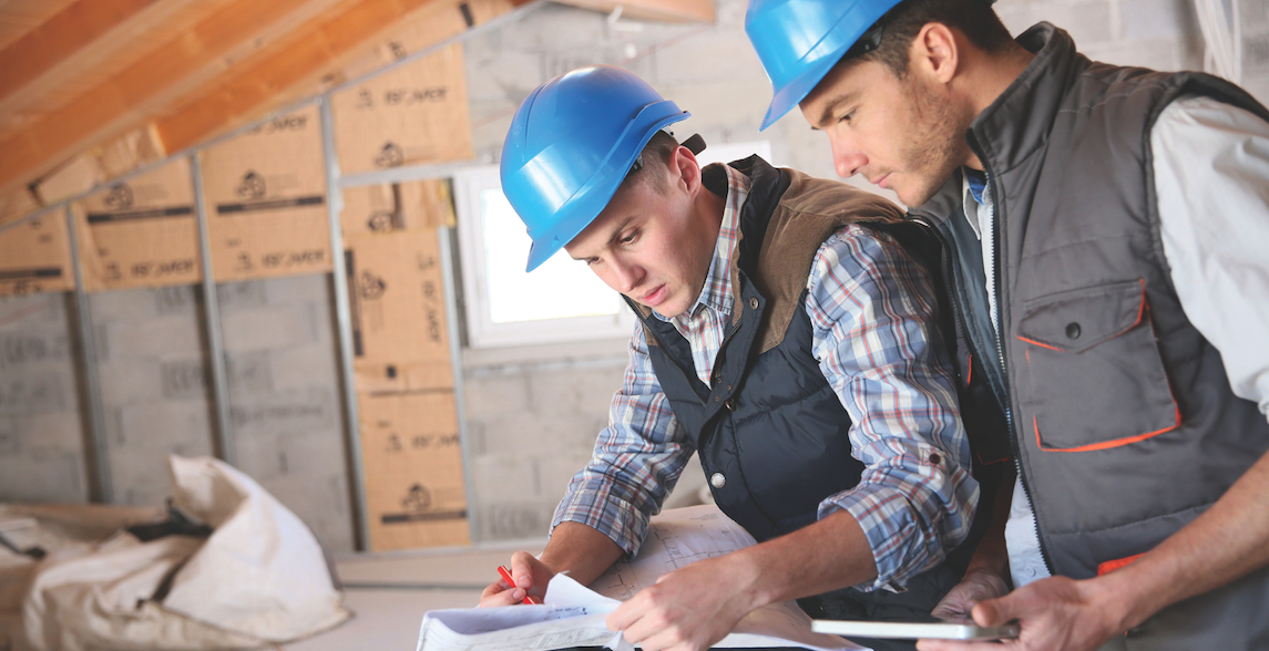 architect and engineer on jobsite check house plan