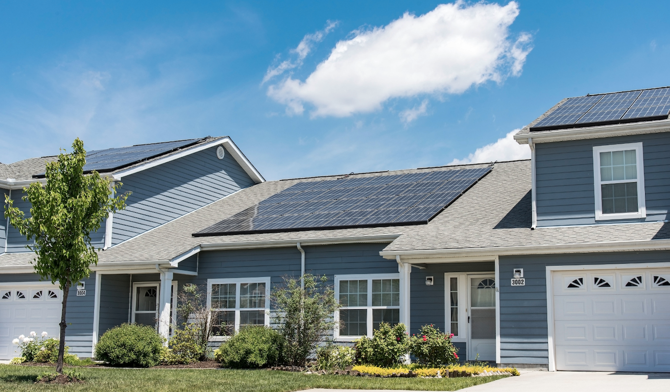 solar panels installed on home roof are an energy alternative that reduces fossil fuel use