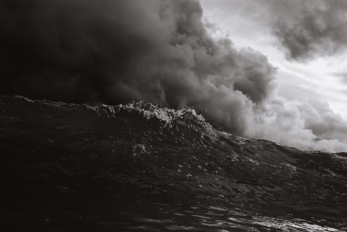 stormy ocean waves with gathering clouds overhead