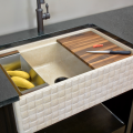 Easy access, big-basin farmhouse sinks are in demand. Stone Forest kicks up the beauty component in its Basket-Weave pattern sink from its Workstation Sink Collection. Carved from Papiro Cream marble, colander, cutting board and drying rack accessories are included. 