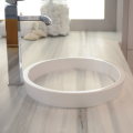 Created in partnership with kitchen and bath designer Matthew Quinn, the innovative Continuum round, oval or square style sink from MTI Baths' Boutique Collection uses the countertop cut-out to form the sink bottom, allowing counter material striations to visually flow ‘through’ the sink. 