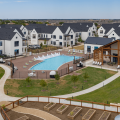 The amenities at multifamily rental development Hermosa Village in Texas center around the pool area