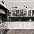 White kitchen cabinets, black accents, photo courtesy SieMatic