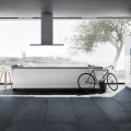 Modern kitchen open to outdoors, bicycle parked, photo courtesy SieMatic