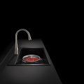 Modern kitchen faucet, black background, photo courtesy Kohler