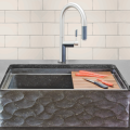 Easy access, big-basin farmhouse sinks are in demand. From Stone Forest’s Workstation Sink Collection, the Wave Front is carved from honed basalt and outfitted with included colander, cutting board and drying rack.