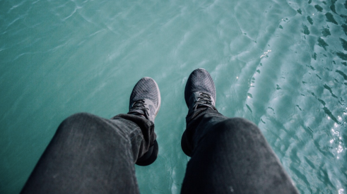 feet suspended over water