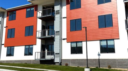 TruExterior Channel siding in a warm orange hue helps set this multifamily project apart